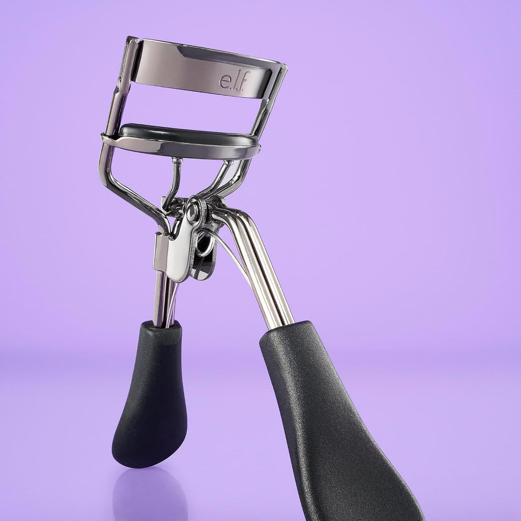 e.l.f. Pro Eyelash Curler. Stainless Steel Lash Curler. Long-Lasting Natural Curl. Ergonomic Design. Includes Replacement Pad. Fits All Eye Shapes